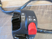 Domino left handlebar switch: headlight and running light switches.