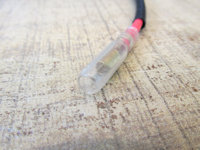 Bullet terminal for connection to wires attached to the regulator/rectifier.