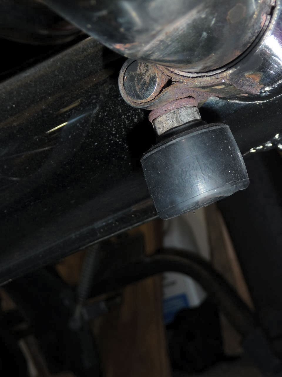 Using the clamp on the crossover pipe as a center stand stop tab for Moto Guzzi V700, V7 Special, Ambassador, 850 GT, 850 GT California, Eldorado, and 850 California Police models.