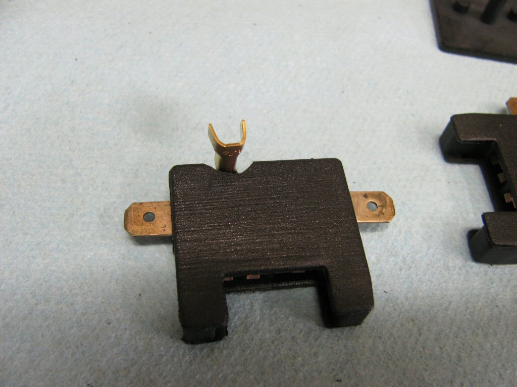 A close up view of the modified fuse holder and cover.