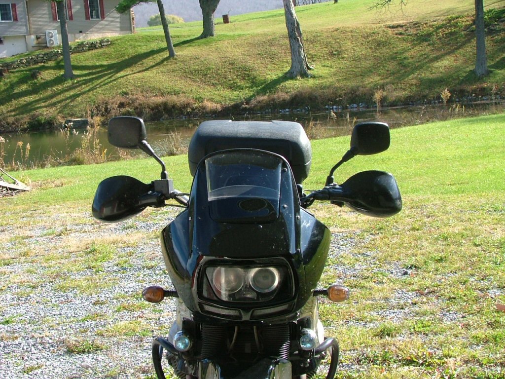 Front view, wide angle. Mounting Triumph Tiger hand guards on a Moto Guzzi Quota 1100 ES.