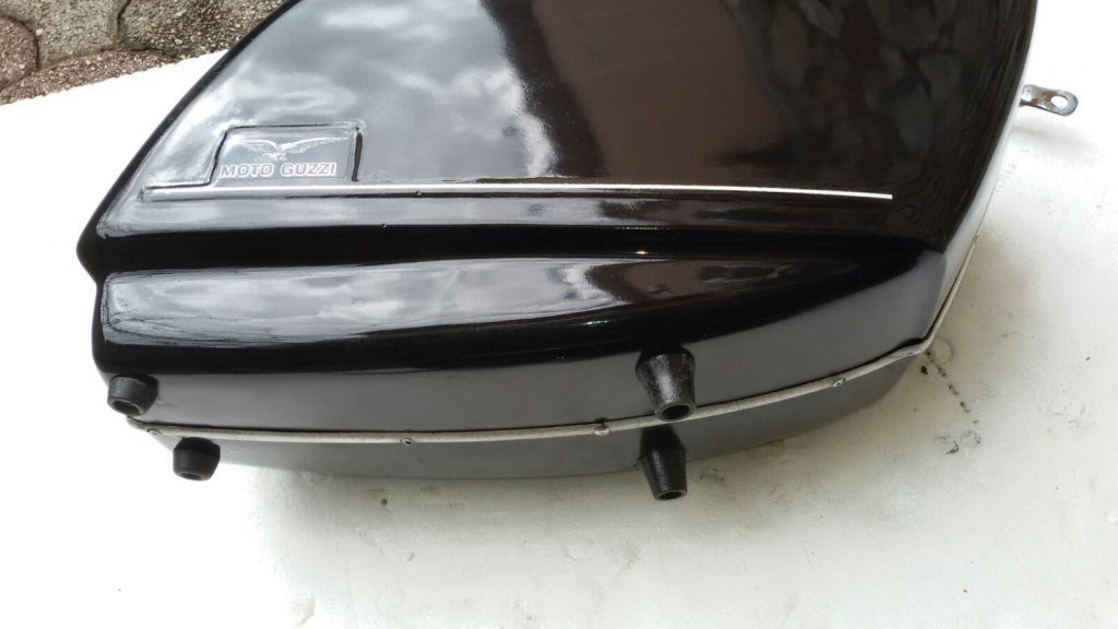 Original Moto Guzzi saddlebags that have had the handles removed from the lid (smaller).