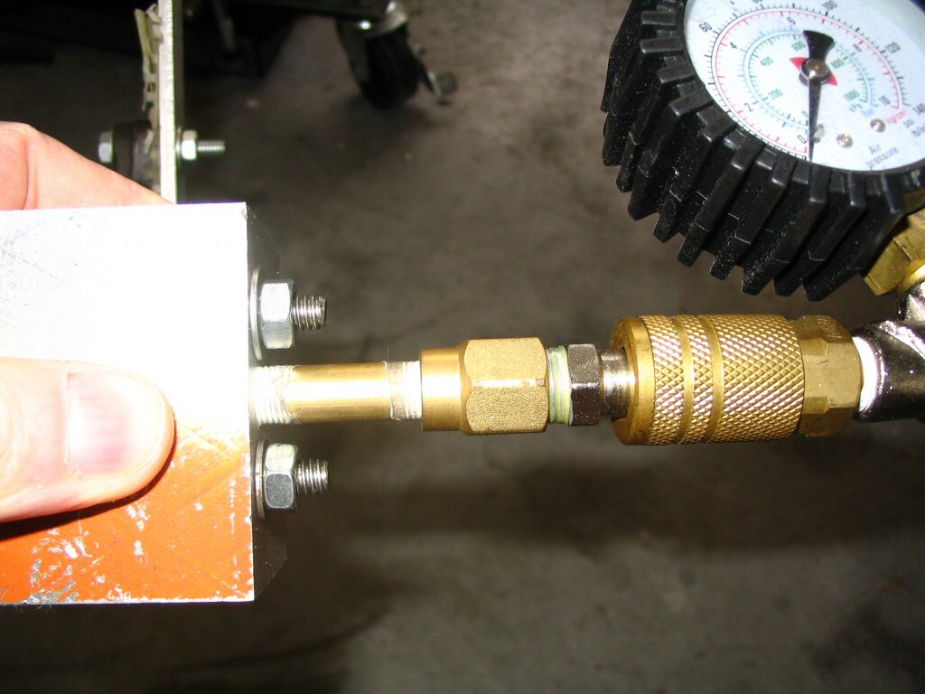 Pressure tester for an oil pressure relief valve.